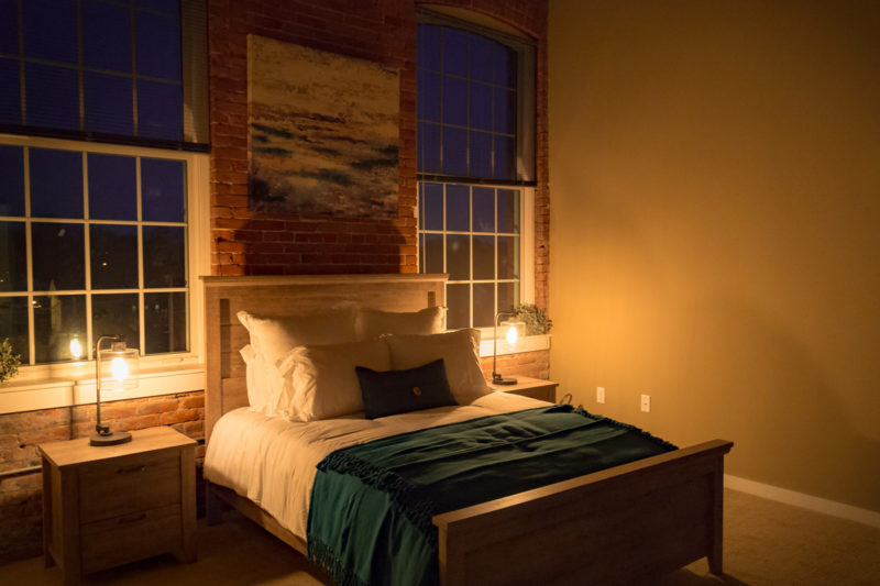 Bedroom in a one bedroom apartment in Pontiac Lofts Building #1 at Pontiac Mills in Warwick, Rhode Island outside of Providence