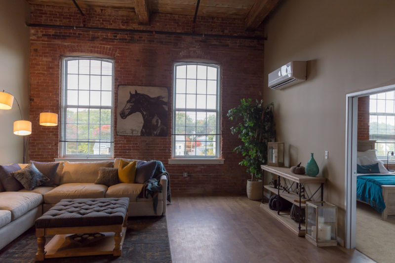 Living room in a one bedroom apartment in Pontiac Lofts Building #1 at Pontiac Mills in Warwick, Rhode Island outside of Providence